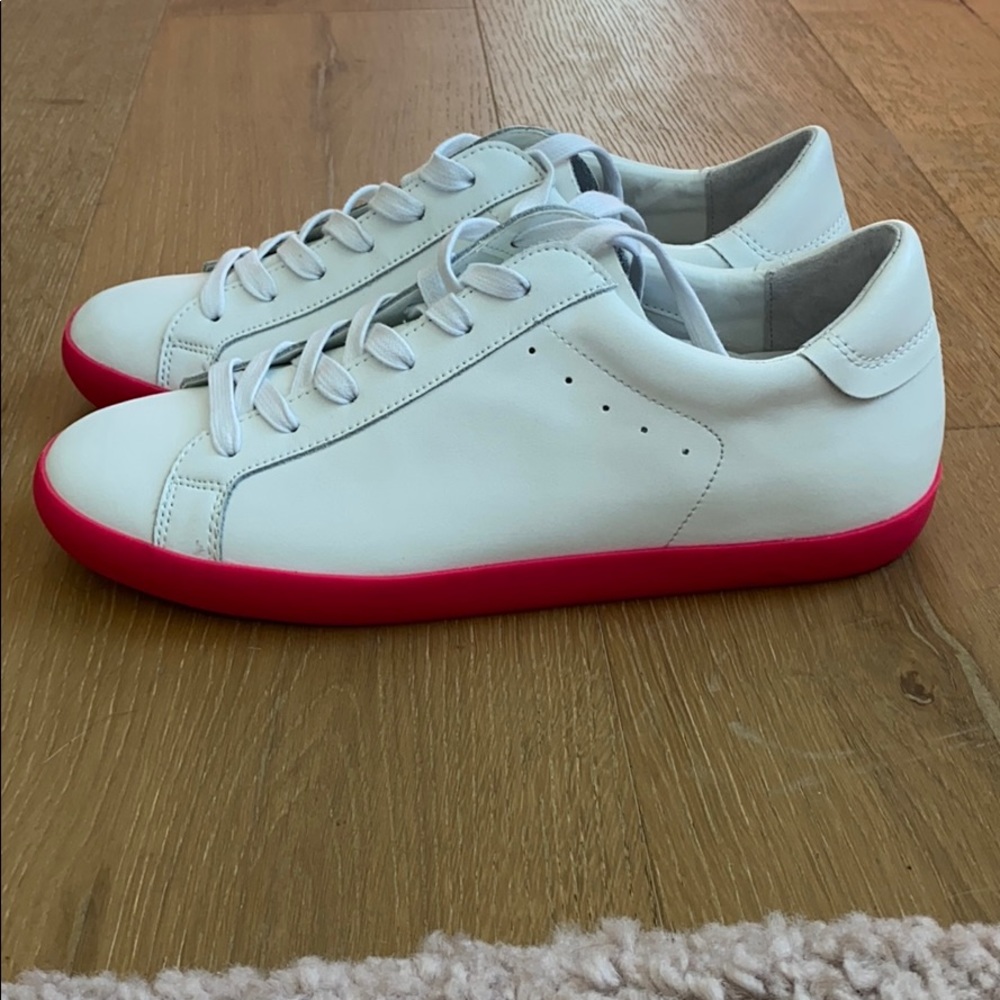 White sneakers with hot pink soles